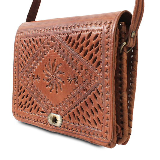 Leather shoulder bag with perforated patterns